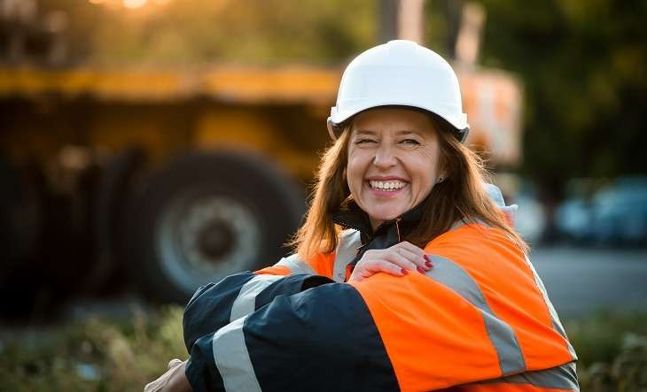 WiC_Female-engineer-highvis-hardhat-seated-sunset -workforce hero